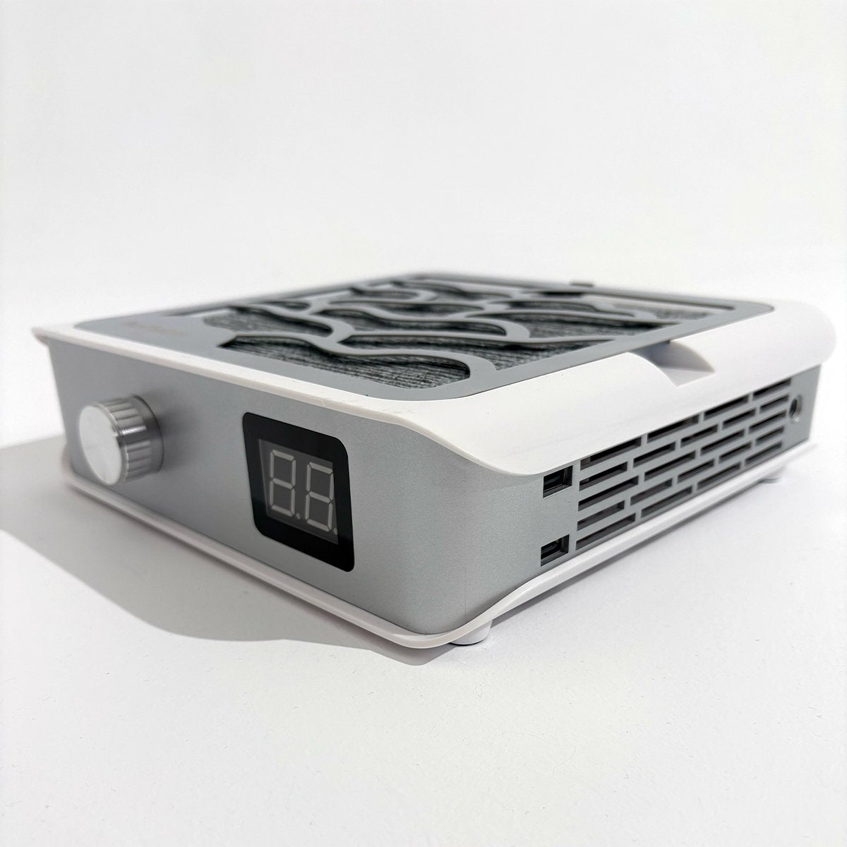 Pochłaniacz pyłu Holivica Pro 2 ukazany pod lekkim kątem, prezentujący boczne kratki wentylacyjne.